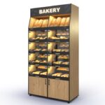 Bakery Backwall accommodating up to 28 SKUs with doored lower and upper open compartments and an illuminated header
